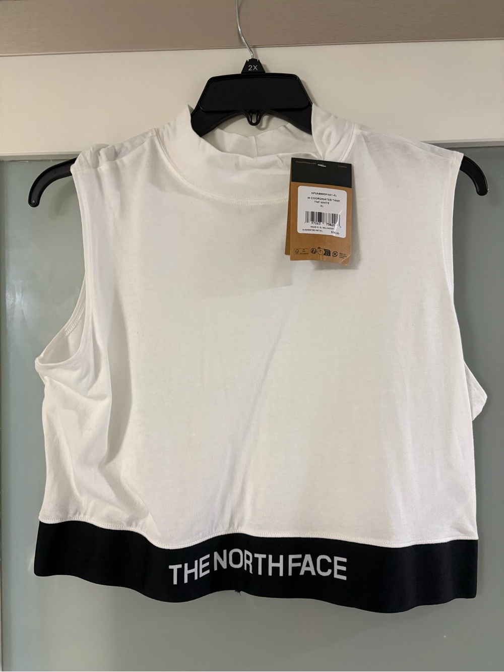 The North Face White Sleeveless Crop Top with Black Logo Hem